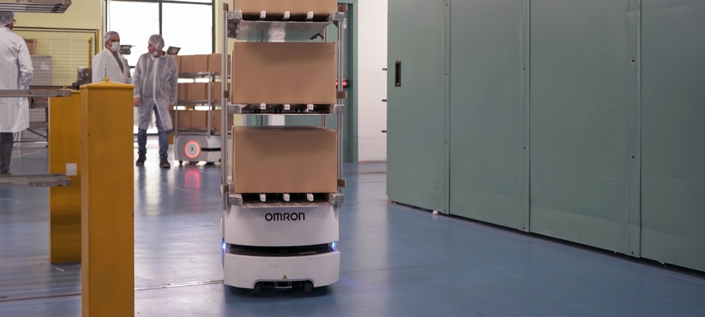 Automated warehouse robots working alongside staff at Diva_cropped