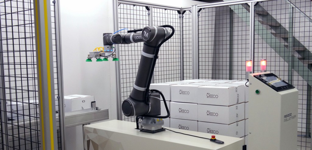 RB1200 cobot palletiser operating on a factory floor, demonstrating compact footprint_cropped