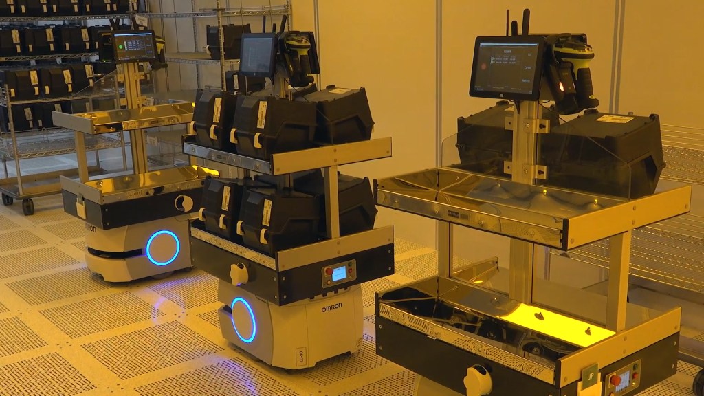 Automated material handling system transporting chips in semiconductor facility
