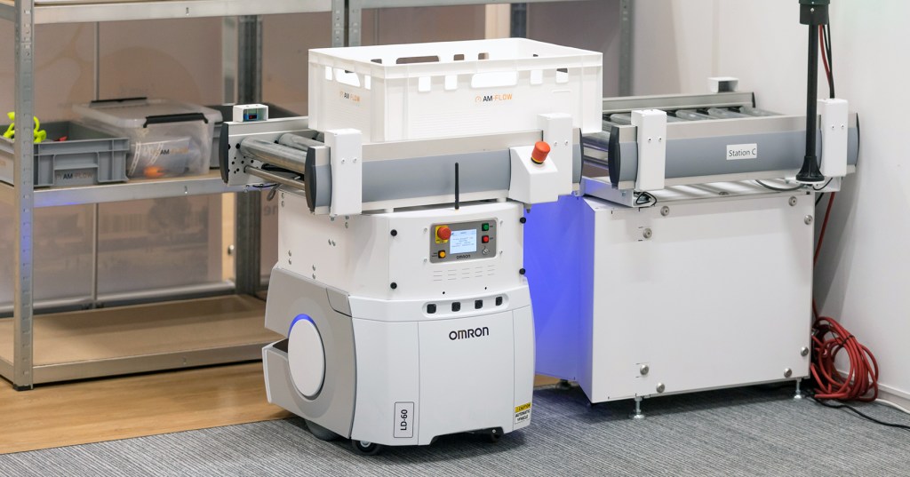 Automated mobile robot transporting 3D printed parts in a factory