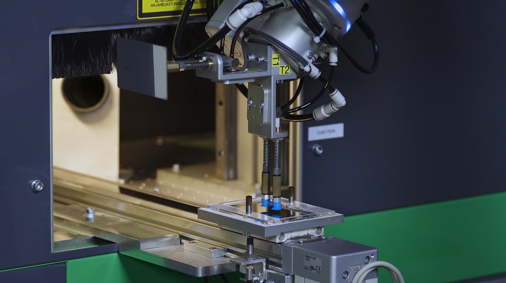 Automated production line with machine tending cobots