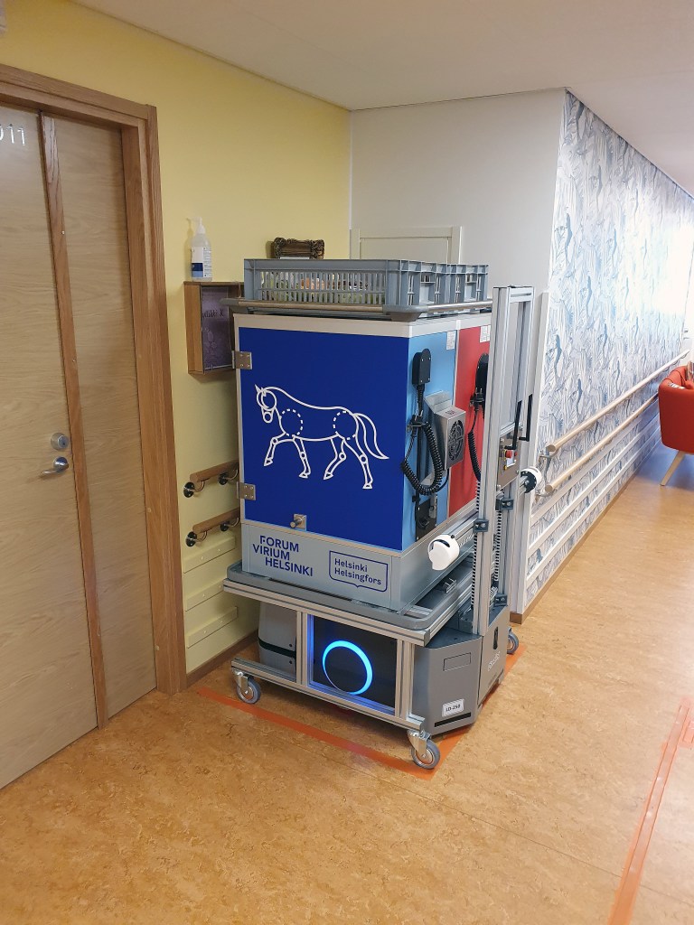 Automated service robot working with manual meal carts
