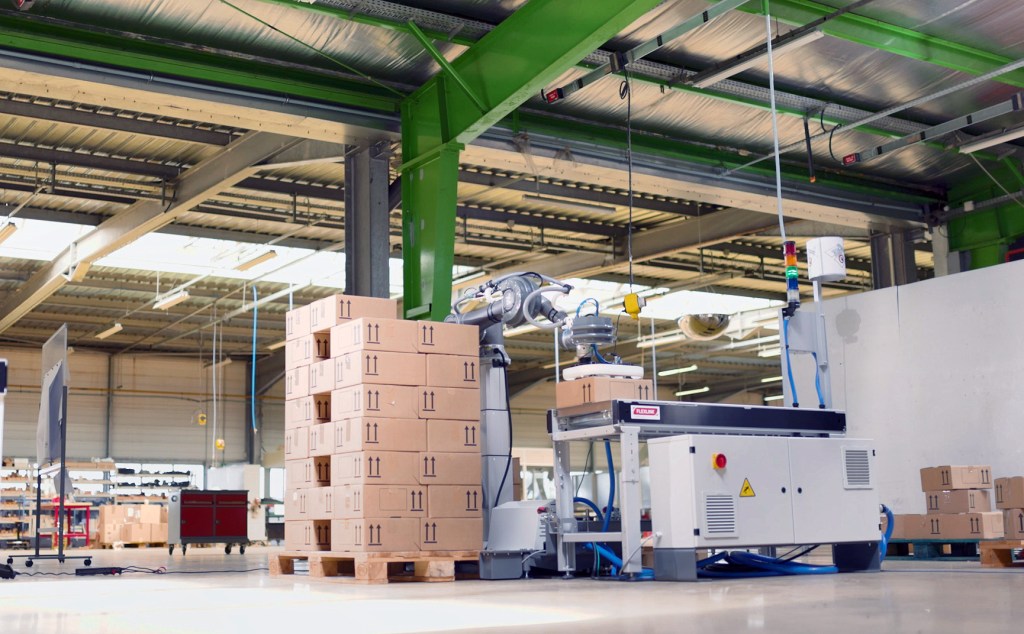 Collaborative palletizer automating box handling in industrial setting