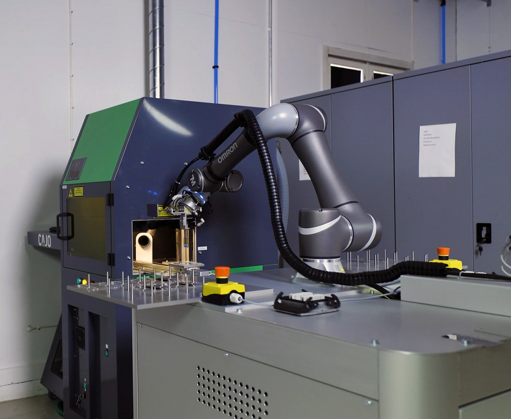 Component with precise laser marking after automated machine tending
