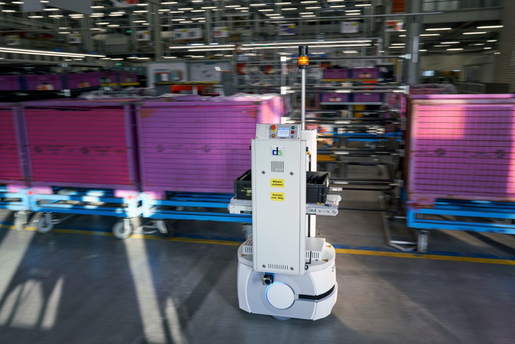 LD-90 AMR logistics automation transporting parts in an automotive manufacturing facility