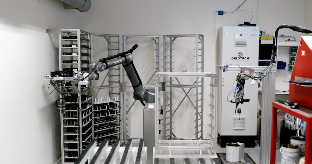 OMRON collaborative robot automating tray handling at Leica Geosystems