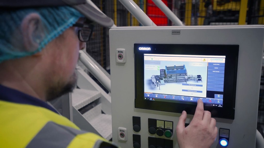 Engineers inspecting automated packaging solutions with Clevertech and OMRON systems