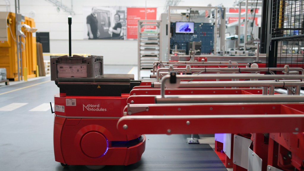 Factory floor with autonomous warehouse robots in operation