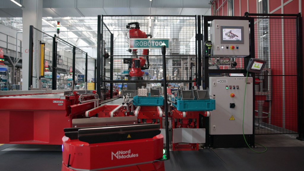 OMRON autonomous warehouse robots integrated with AutoStore system