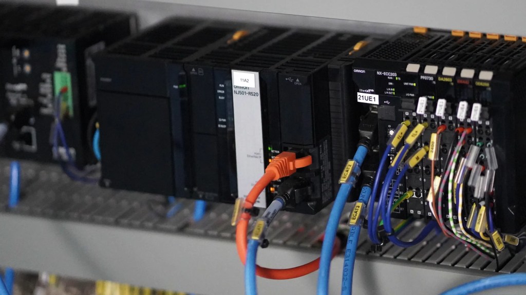 OMRON NJ controller and IO modules used in an automated bottle handling system